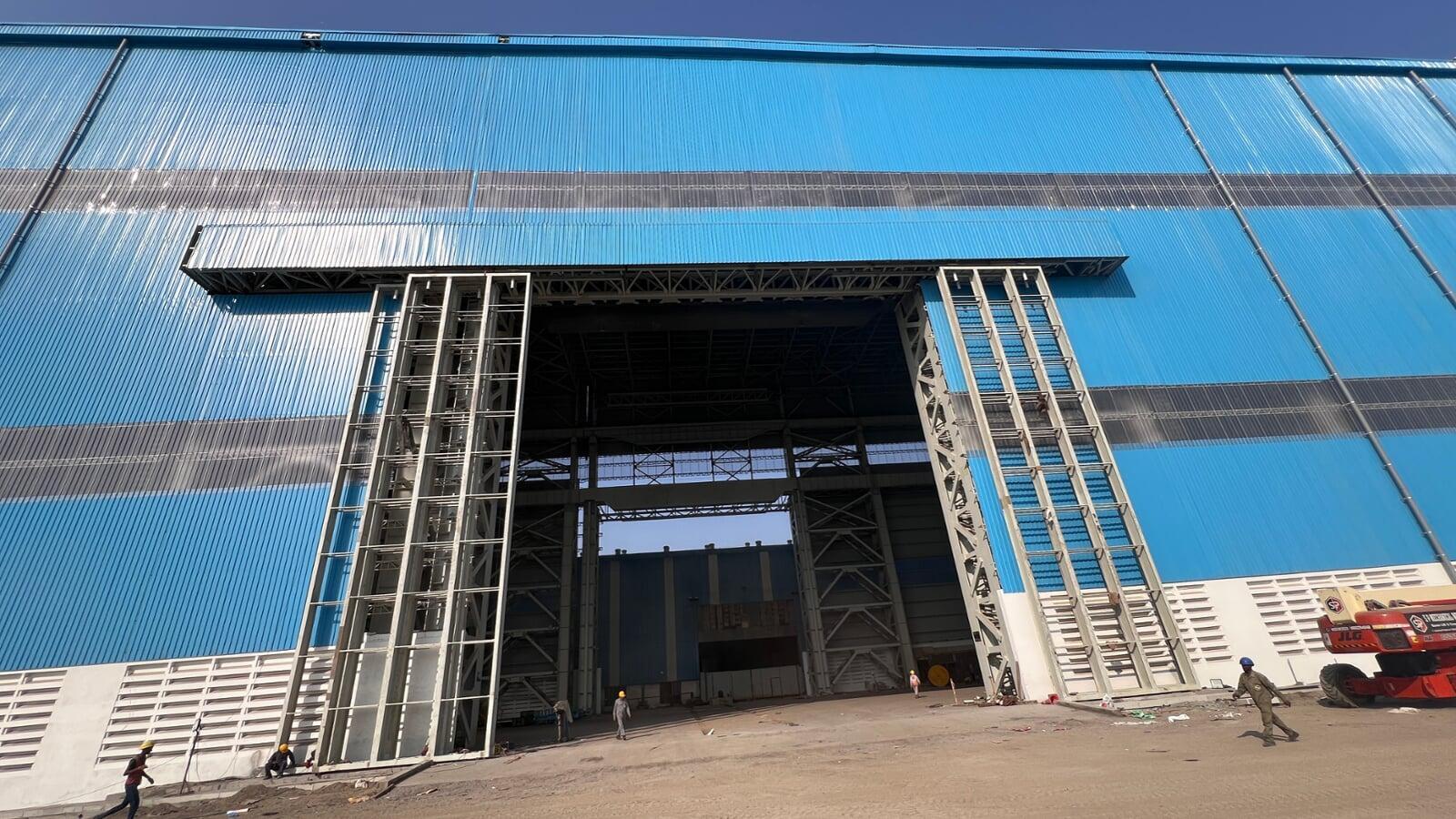Commercial architectural roofing at Oberoi Mall, Mumbai: Specialized Kliplok roof-on-roof installation by Rishonn & Reyansh for leak-proof retail infrastructure.